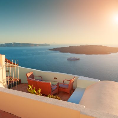 Beautiful,Sunset,At,Santorini,Island,,Greece.,Chairs,On,The,Terrace