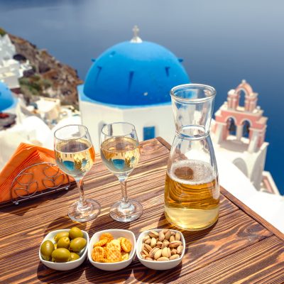 Bottle,Of,Wine,And,Two,Glasses,On,The,Table,,Against