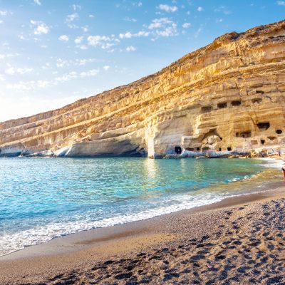 Matala Beach With Caves On The Rocks That Were Used.