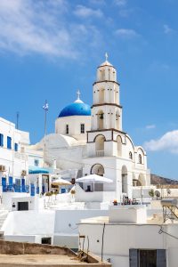 Walking Through Santorini Streets. Traditional Greek White Houses Architecture.