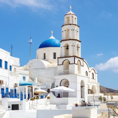 Walking Through Santorini Streets. Traditional Greek White Houses Architecture.